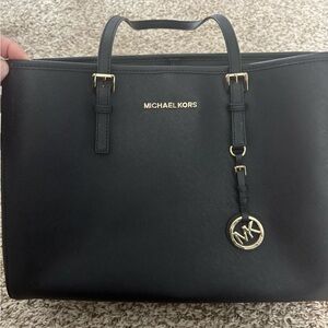 Michael Kors Black Handbag with Gold Details